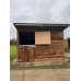 12x12 with top/bottom stable doors, wooden skids & an overhang