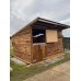 12x12 with top/bottom stable doors, wooden skids & an overhang